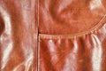 Brown leather texture. Useful as background for any design work. Macro photography of outerwear made of genuine leathe