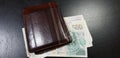 Brown leather wallet with czech republic coruna banknotes