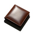 Brown Leather Wallet on Dark Surface Royalty Free Stock Photo