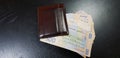 Brown leather wallet full with five hundred hryvnia banknotes