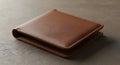 Brown leather wallet on gray surface Royalty Free Stock Photo