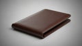 Brown leather wallet on a neutral background. The wallet is closed, displaying a smooth texture Royalty Free Stock Photo