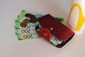 Brown leather wallet with plastic cards and Bank of Russia banknotes. Russian money for 200 rubles and coins. McDonald`s Cup Royalty Free Stock Photo