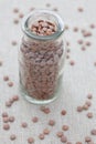 Brown lentils in a small glass jar