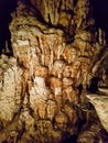 Brown limestone chalk stone formation light middle focus inside stalactive cave pai tour dark guided travel chiang mai Royalty Free Stock Photo