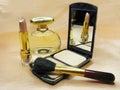 Brown lipstick powder and perfume bottle Royalty Free Stock Photo