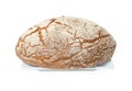 Brown loaf of bread with flour sprinkled on top on a white square plate on white background