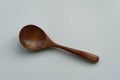 Brown long handle wooden spoon on white background Royalty Free Stock Photo