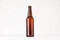 Brown longneck beer bottle mock up. Template for advertising, design, branding identity on white wood table. Royalty Free Stock Photo