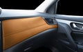 Brown luxury modern car Interior. Dashboard. Detail of modern car interior. Part of orange leather seats with stitching in