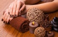 Brown manicure on a bamboo background