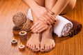 Brown manicure and pedicure on the bamboo