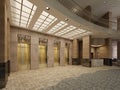 Brown marble and metal elevator hall in an hotel with a large columns. Built-in light in the ceiling