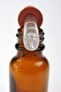 Brown medical bottle and a pipette Royalty Free Stock Photo