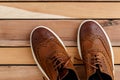 Brown mens shoes on wooden background. top view Royalty Free Stock Photo