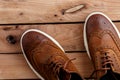 Brown mens shoes on wooden background. top view Royalty Free Stock Photo