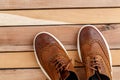 Brown mens shoes on wooden background. top view Royalty Free Stock Photo