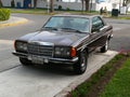 Brown Mercedes-Benz 230C coupe parked in Lima