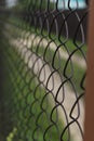 Brown mesh fence, close-up, summer photo in the village