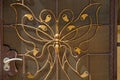 Brown metal texture in wrought iron butterfly pattern with door handle on the wall