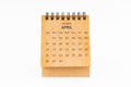 Brown mini desk calendar for April 2024 isolated on white