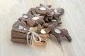 Brown moravian dark gingerbreads with sliced almonds on wooden table, christmas cookies Royalty Free Stock Photo