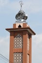 A brown mosque tower with chrome top Royalty Free Stock Photo