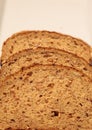 Brown multigrain bread slices on a white plate Royalty Free Stock Photo