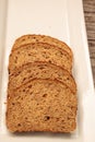 Brown multigrain bread slices on a white plate Royalty Free Stock Photo