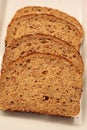 Brown multigrain bread slices on a white plate Royalty Free Stock Photo