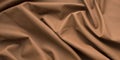 Brown natural leather background, rumpled, light fabric