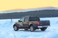 Brown Nissan Navara on ice of lake Baikal