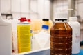 Brown non descript chemical plastic container in a laboratory set close up shot shallow depth of field Royalty Free Stock Photo