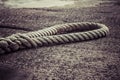 Brown old anchor rope at ship dock pier Royalty Free Stock Photo