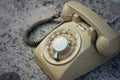 Brown old phone vintage style on a floor. Royalty Free Stock Photo