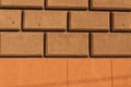 Brown and orange brick stylized wall texture. Royalty Free Stock Photo