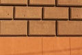 Brown and orange brick stylized wall texture.