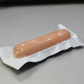 a brown packaged sausages