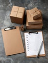 Checklists and Brown Packages on a Textured Surface Ready for Shipping or Organization Activities During the Day Royalty Free Stock Photo