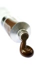 Brown paint squeezed from tube