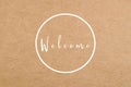 Brown Paper Background with Welcome Text and Circle Design Element Royalty Free Stock Photo