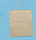 Brown paper bag on blue background, Kraft bag Royalty Free Stock Photo