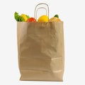 Brown paper bag with vegetables. Recycled pack with fresh organic food isolated on white background