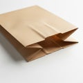 Brown paper bag on a white background. It features a rectangular shape with side Royalty Free Stock Photo