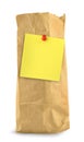 Brown paper bag with yellow note Royalty Free Stock Photo