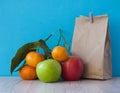 School lunch. Brown paper breakfast bag and mixed fruit Royalty Free Stock Photo