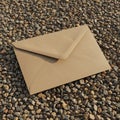 A brown paper envelope placed on a surface of small, round pebbles. The envelope is Royalty Free Stock Photo