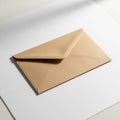 A brown paper envelope is placed on a white surface. The envelope is positioned Royalty Free Stock Photo