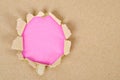 Brown Paper explosion on pink background. Royalty Free Stock Photo