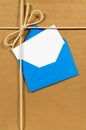 Brown paper package, address card or label, blue envelope, copy space Royalty Free Stock Photo